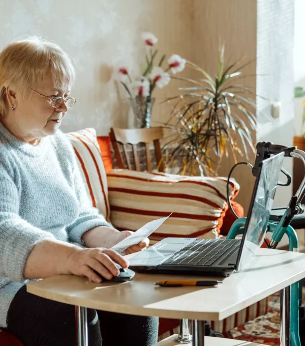 life-insurance-disability-medical-insurance-policy-for-seniors-mature-woman-in-glasses-with-laptop